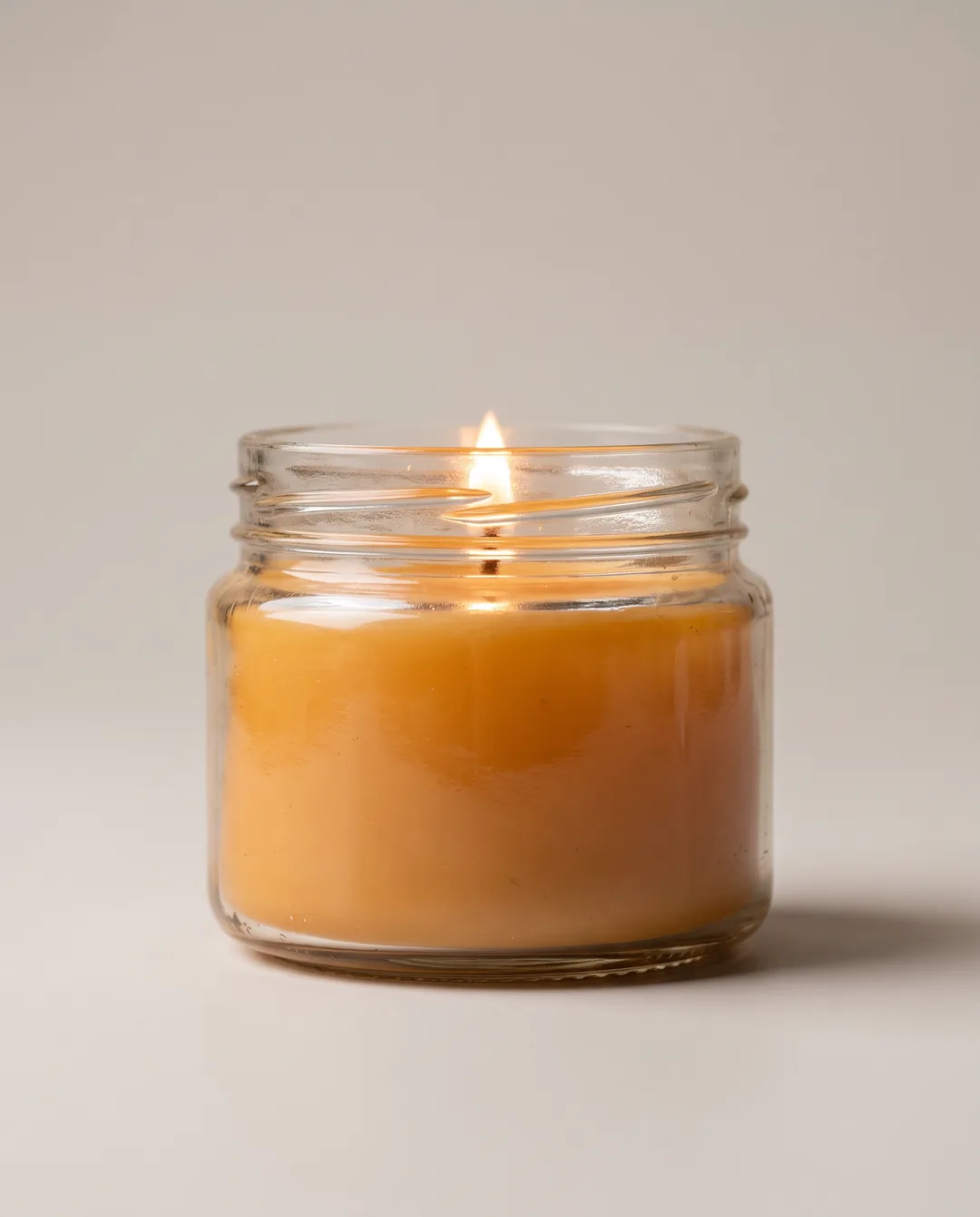 AI ad image of the glass jar candle, Studio, Feed 4:5